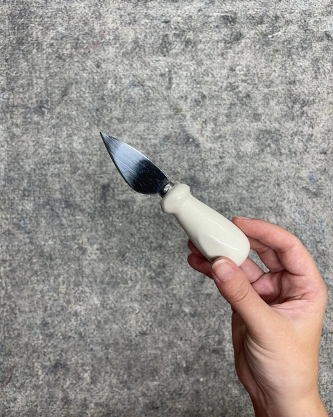 Rae Dunn Oui Ceramic Handle Cheese Knife