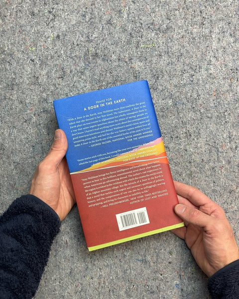 A Door in the Earth Hardcover by Amy Waldman