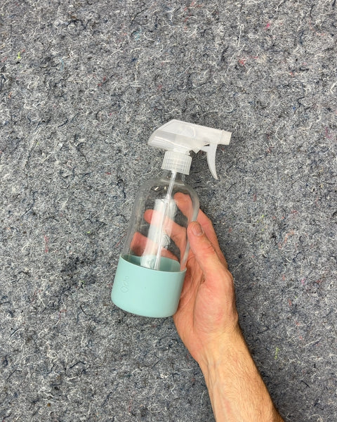 Clear Glass Spray Bottle with Blue Silicone Sleeve