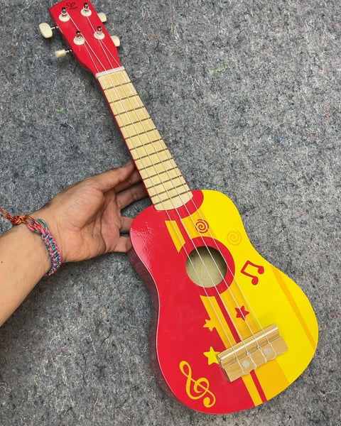 Red and Yellow Toy Ukulele