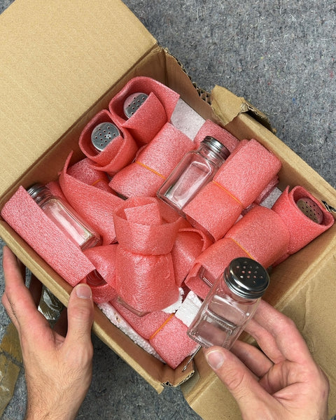 A Box Full Of Spice Shakers