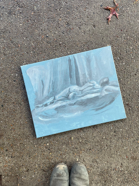 Study in Person Laying in Front of Art Students