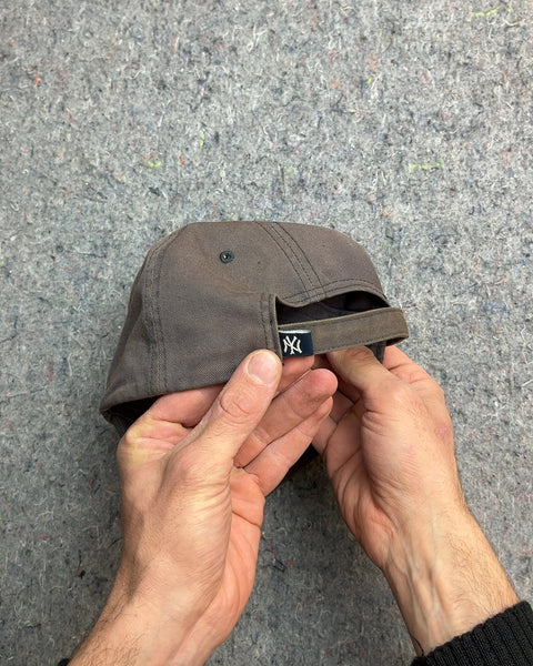 A New York Yankees Baseball Cap So Used It Has A Charm To It