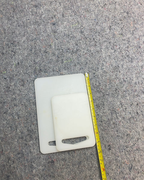 Two White Plastic Cutting Boards