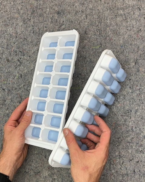 Two White and Blue Ice Cube Trays