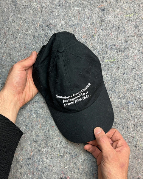 Black Baseball Cap with (Too Long?) Embroidered Text