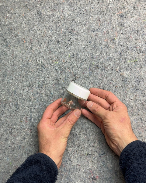 Small Glass Jar with White Lid That You Have To Push Down Before It Can Open So Perfect For Pills