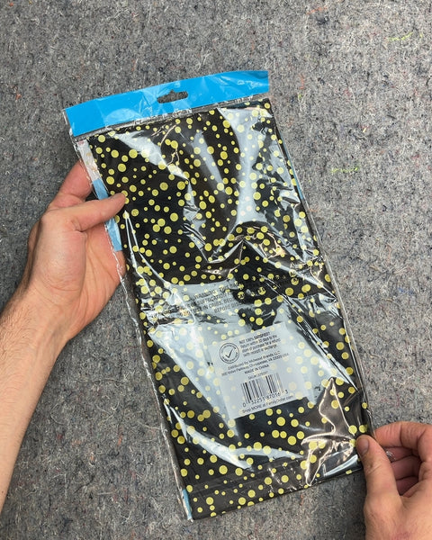 Surprise! Plastic Table Cover, Black with Yellow Dots 54x108"