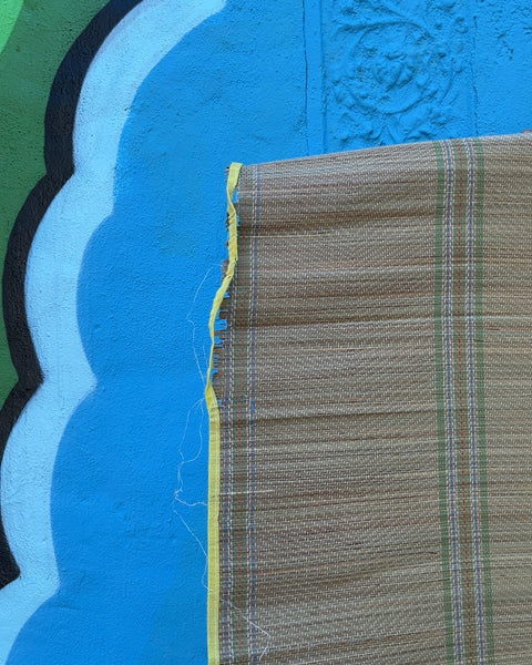 Woven Straw Beach Mat with Yellow Trim Used In Top Left Corner, 35x70"
