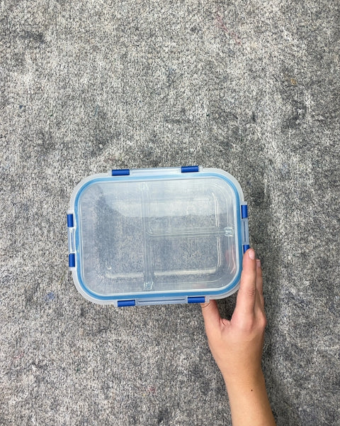 A Third Clear Plastic Lunch Box with Blue Clasps