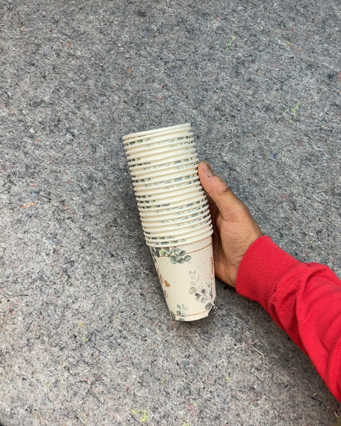 Stack of Disposable Paper Cups with Eucalyptus Design