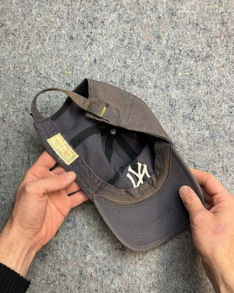 A New York Yankees Baseball Cap So Used It Has A Charm To It