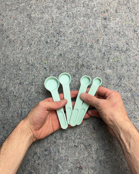 Set of Four Green Measuring Spoons That Clips Together Nicely