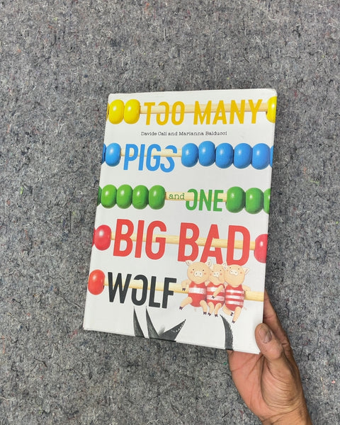 Too Many Pigs and One Big Bad Wolf by Davide Cali and Marianna Balducci