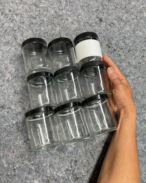 Set of Eight Glass Jars with Black Lids