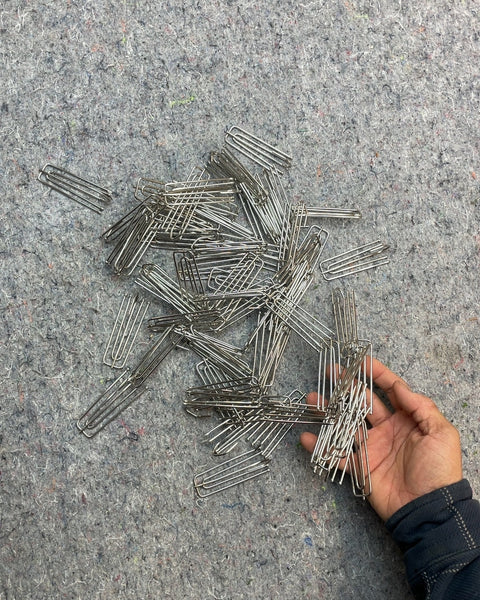 A Grip of Metal Curtain Hooks