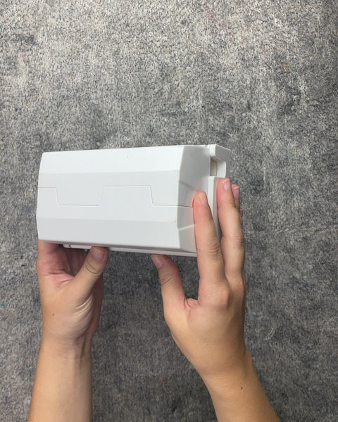 White Plastic Outlet Cord Cover