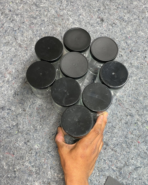 Set of Eight Glass Jars with Black Lids