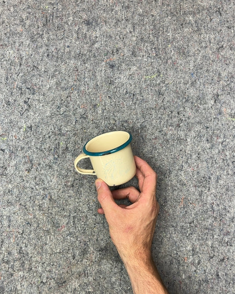 Small Faded Enamel Mug with Blue Rim