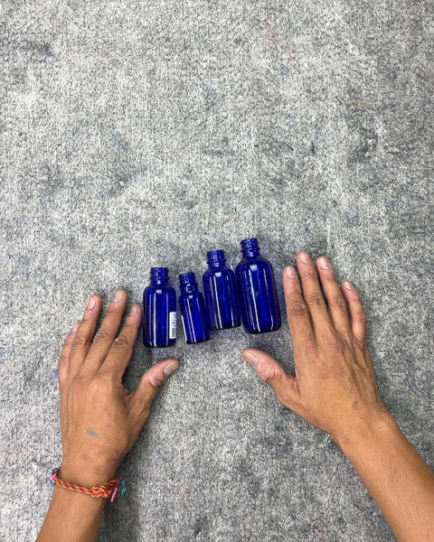 Four Cobalt Blue Glass Bottles