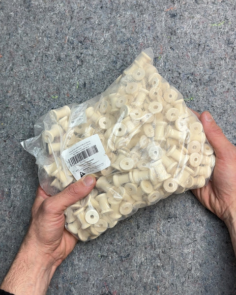 A Whole Bag Of Wood Spools For Crafting