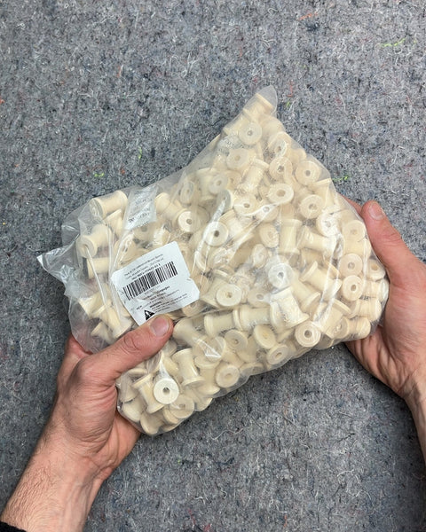 A Whole Bag Of Wood Spools For Crafting