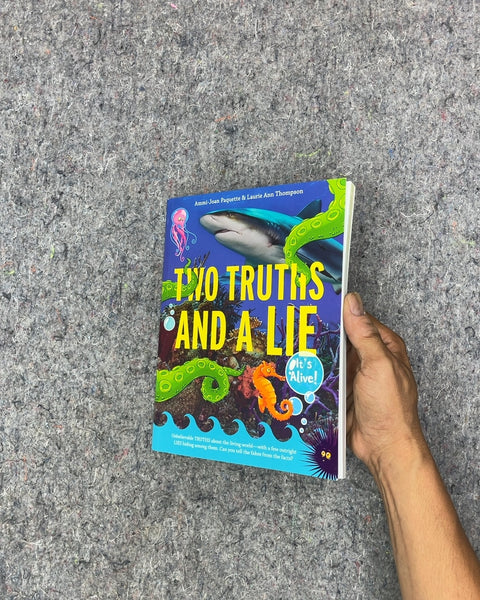Two Truths and a Lie by Ammi-Joan Paquette & Laurie Ann Thompson
