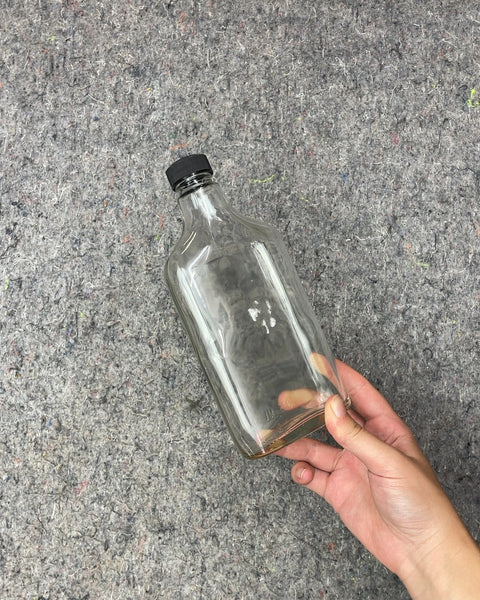 Clear Glass Bottle with Black Cap