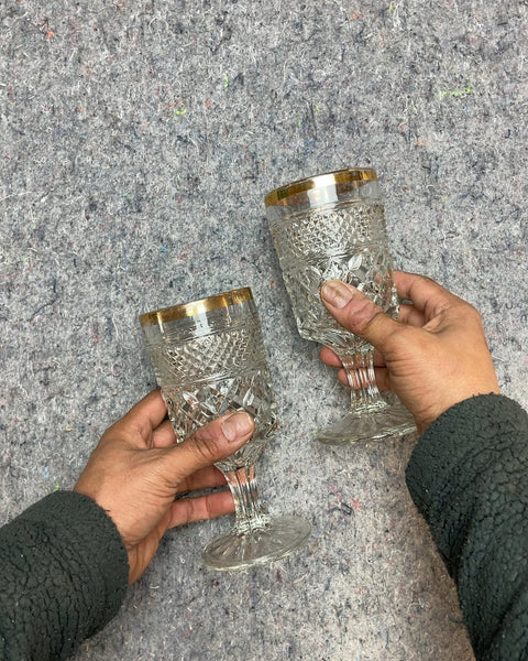 Two Embossed Glass Goblets with Gold Trim