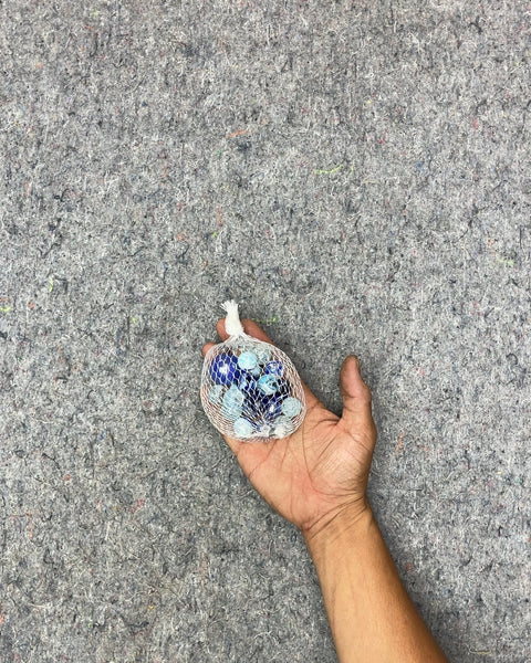 Bag of Blue and Clear Glass Marbles