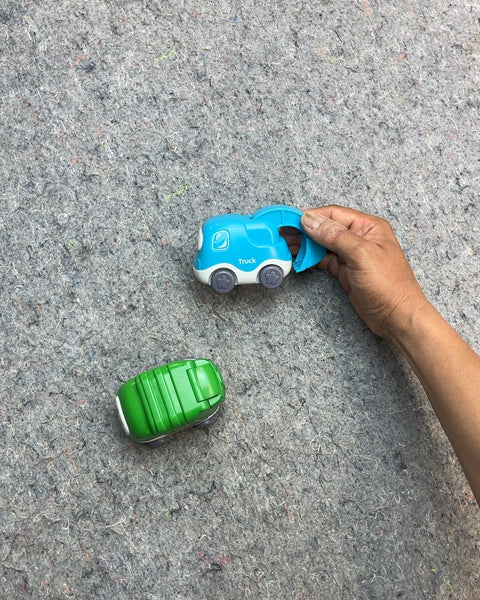 Green and Blue Toy Trucks