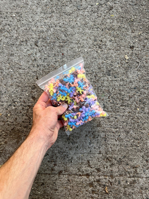 A Bag Full Of Tiny Plastic Babies