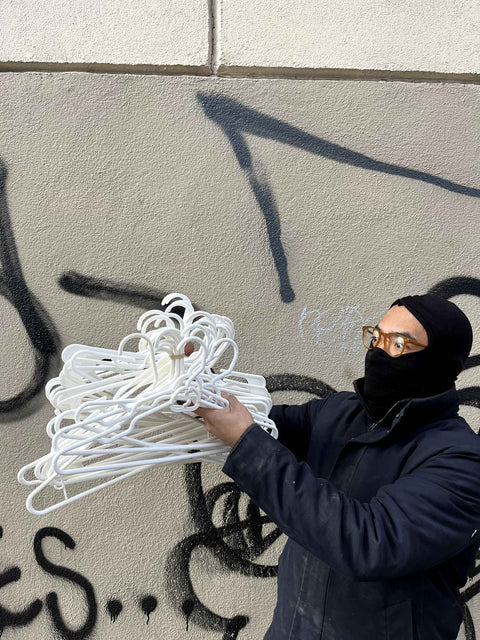 A Big Bundle Of White Hangers