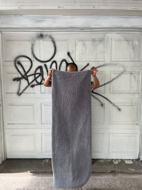 A Gray Bath Mat So Long It Might Come Out Of Your Bathroom, 54x18"
