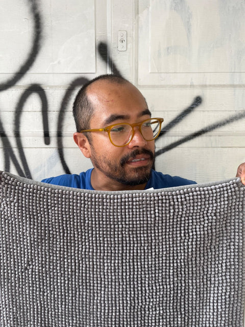 A Gray Bath Mat So Long It Might Come Out Of Your Bathroom, 54x18"