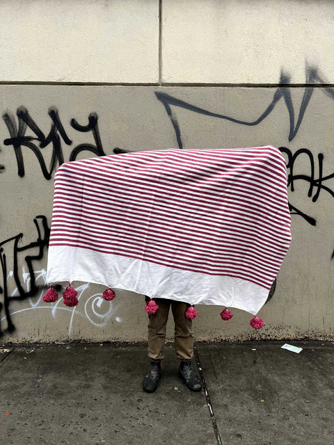 A Pretty Striped Pom-Pom Throw Blanket