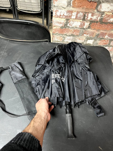 A Serious Black Umbrella With Sleeve
