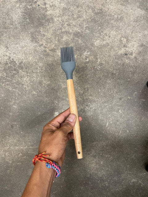 A Silicone & Wood Sauce Brush
