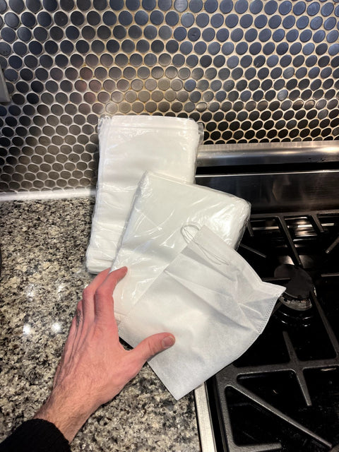 A Whole Bunch Of Mesh Fabric Bags For Cooking