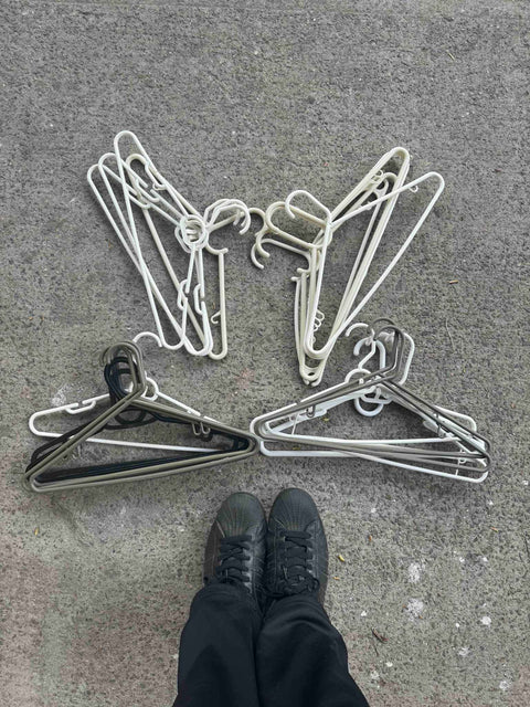 A Whole Bunch Of The Regular Plastic Hangers