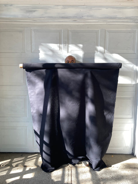 Mad Biiig Roll Of Black Fabric Perfect For A Backdrop