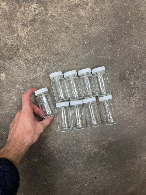 Bunch Of Glass Jars With White Lids