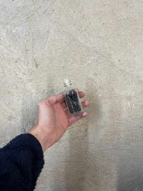 Couple Matches In A Pretty Glass Bottle