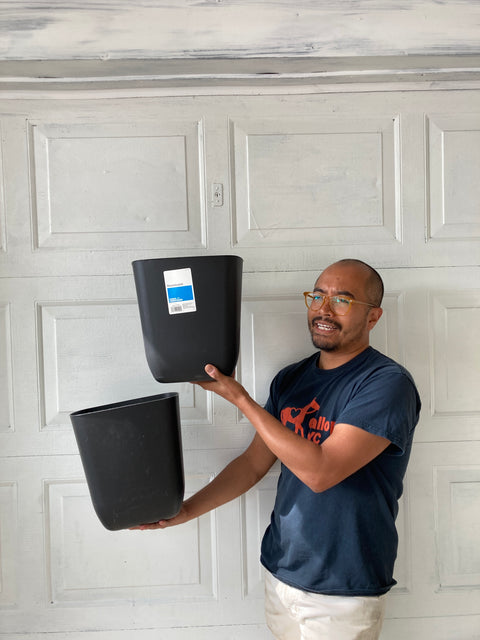Two Plastic Wastebaskets