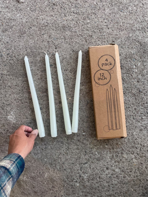 Four White Taper Candles