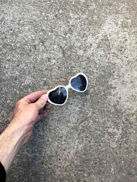 Heart-Shaped Sunglasses That Also Have Dots On The Lenses For Some Reason