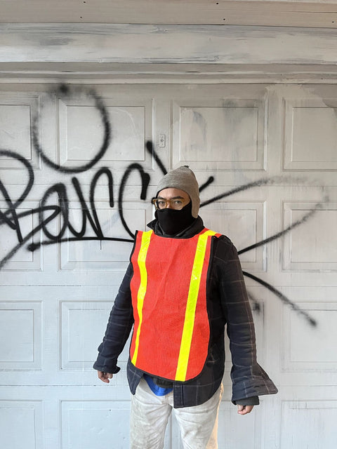 High Visibility Safety Vest To Help A Plane Land