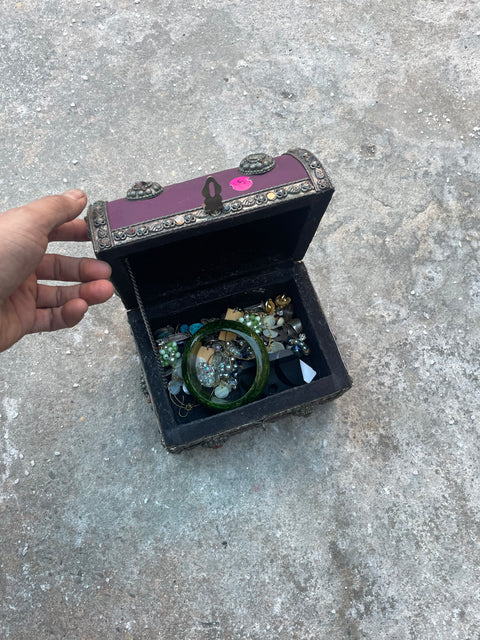 Purple Treasure Chest with a Bunch of Jewelry In It