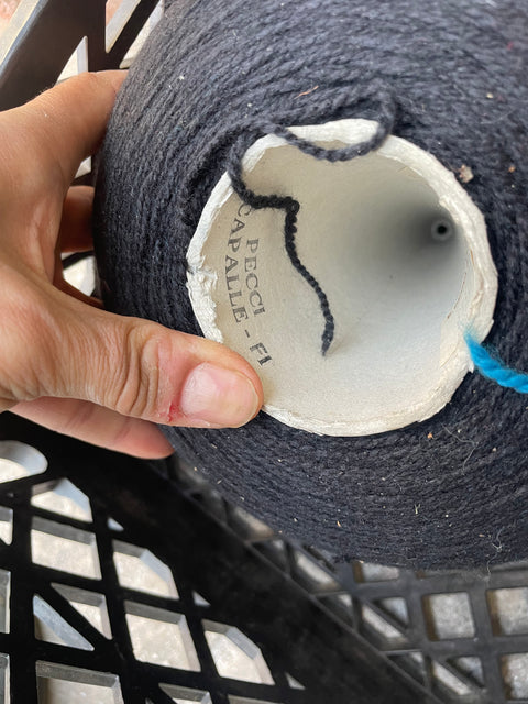 A Whole Bunch of Spools of Yarn