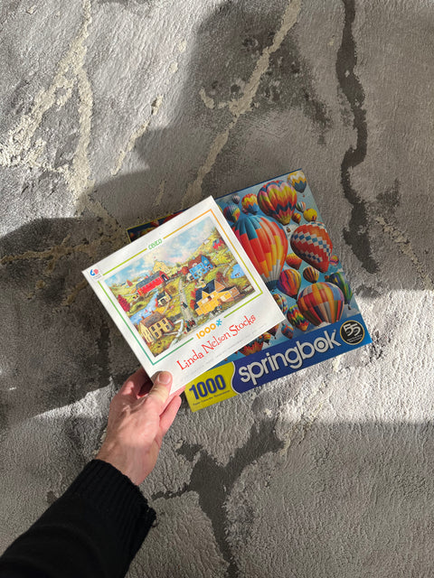 Two Puzzles Of 1000 Pieces Each